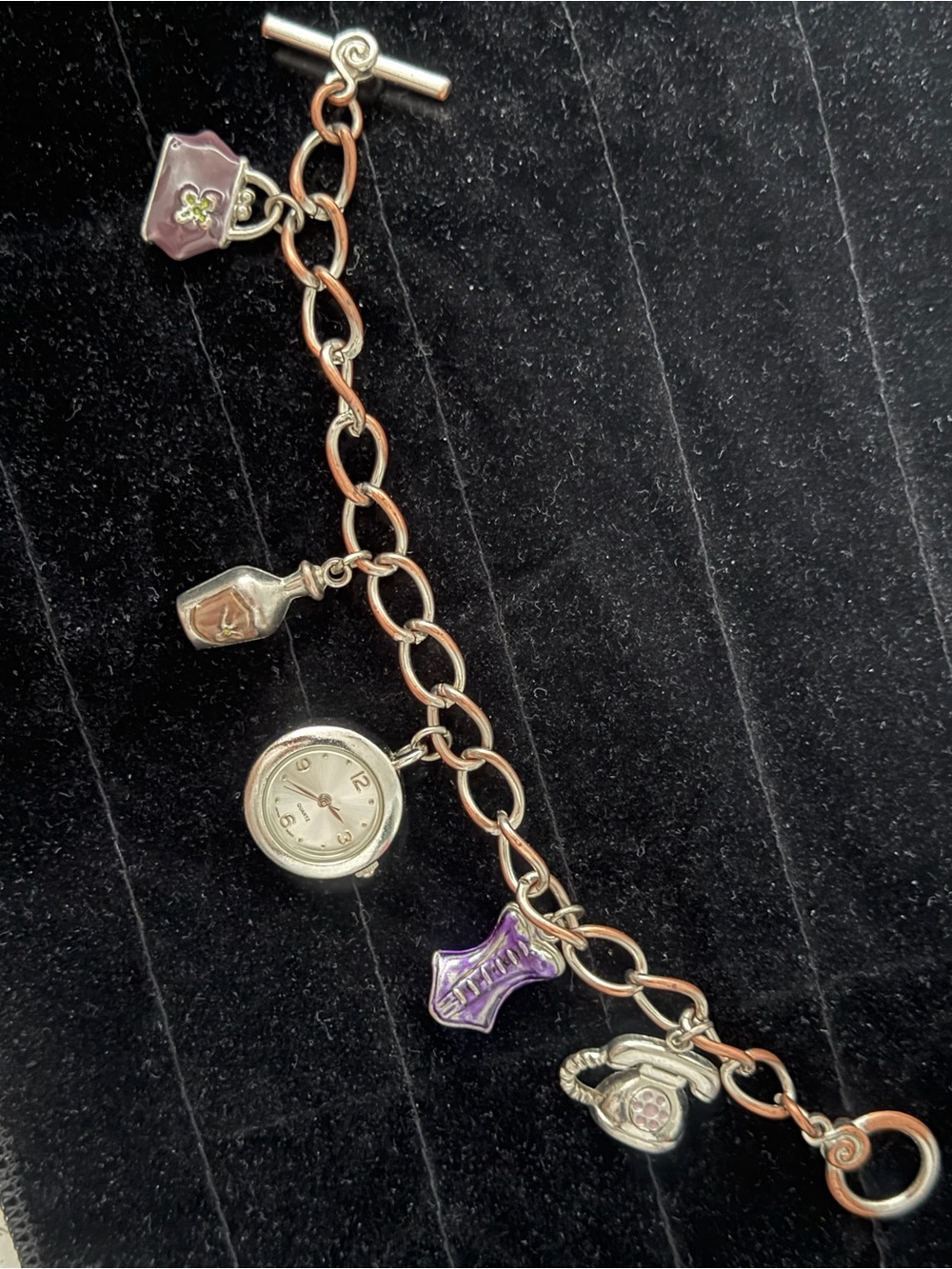 Vintage women's silver-tone charm bracelet watch…